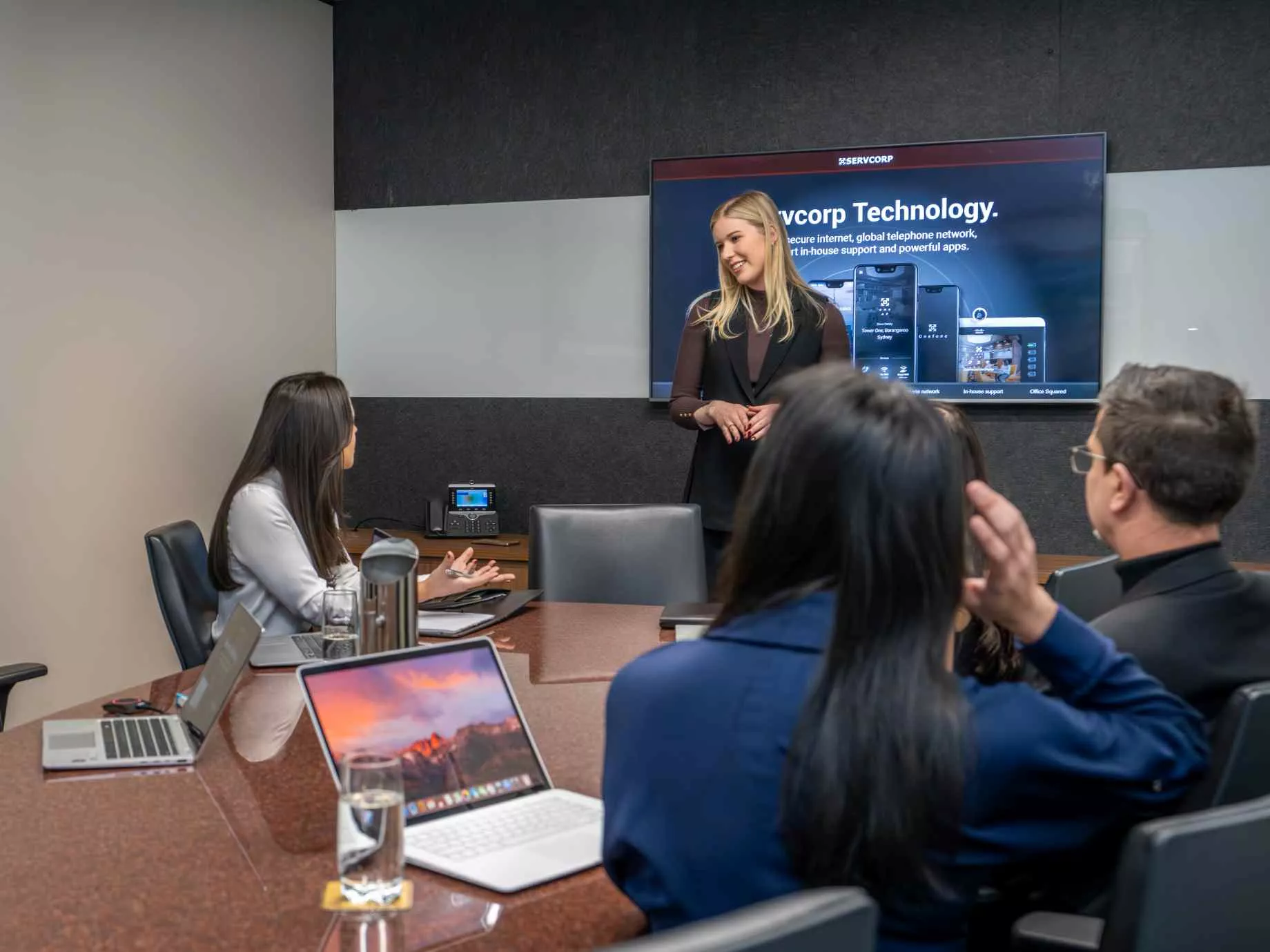 Board room with IT presenting to clients about Servcorp Technology in Chifley Tower