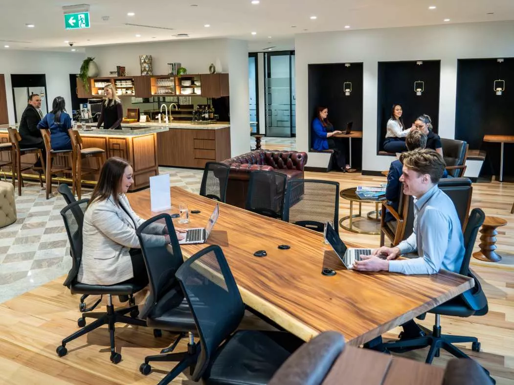 Close up on people enjoying their time in a modern coworking space in Chifley Tower