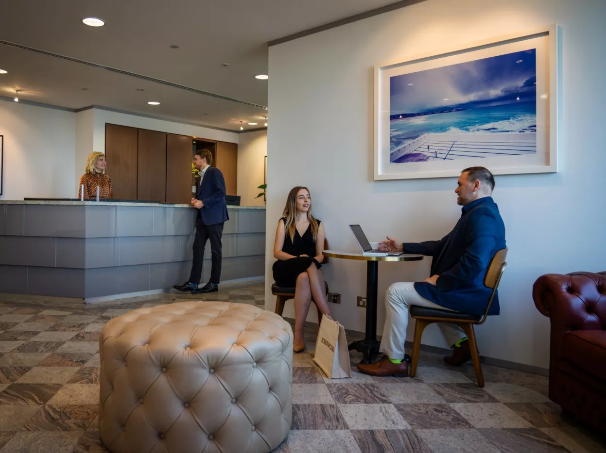Clients working in a modern coworking space in Servcorp Westfield Tower 2