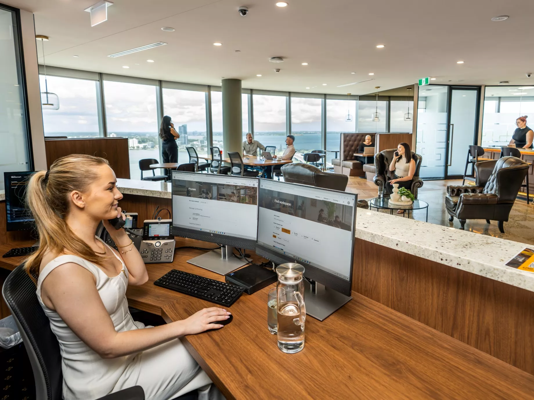 Dedicated receptionist on the phone to a client in Servcorp Capital Square Tower 3 Perth